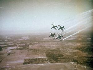 US Navy Stunt Pilots of the Blue Angels Flying their F9F Jets During an Air Show by J^ R^ Eyerman