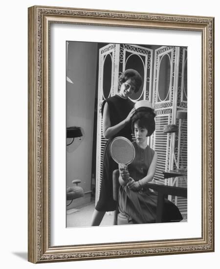 Jackie Kennedy Style Pillbox Hats Being Tried on by Models at Charles A. Stevens and Co-Francis Miller-Framed Photographic Print