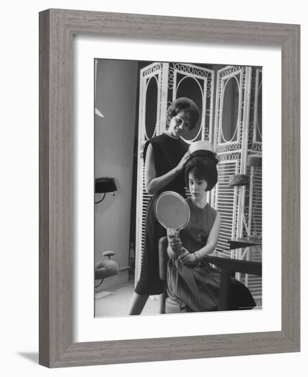 Jackie Kennedy Style Pillbox Hats Being Tried on by Models at Charles A. Stevens and Co-Francis Miller-Framed Photographic Print