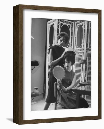 Jackie Kennedy Style Pillbox Hats Being Tried on by Models at Charles A. Stevens and Co-Francis Miller-Framed Photographic Print