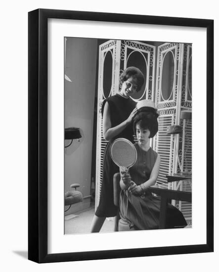 Jackie Kennedy Style Pillbox Hats Being Tried on by Models at Charles A. Stevens and Co-Francis Miller-Framed Photographic Print