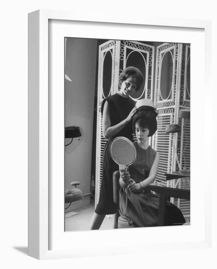 Jackie Kennedy Style Pillbox Hats Being Tried on by Models at Charles A. Stevens and Co-Francis Miller-Framed Photographic Print