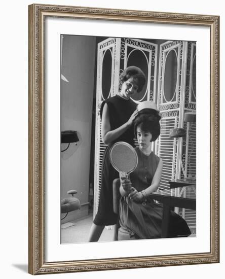 Jackie Kennedy Style Pillbox Hats Being Tried on by Models at Charles A. Stevens and Co-Francis Miller-Framed Photographic Print