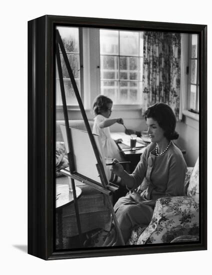 Jackie Kennedy, Wife of Sen, Painting on an easel as Daughter Caroline Paints on Table at Home-Alfred Eisenstaedt-Framed Premier Image Canvas