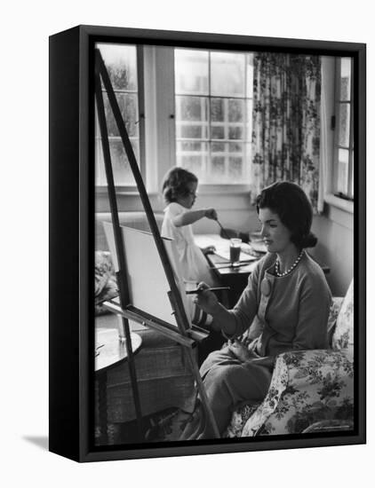 Jackie Kennedy, Wife of Sen, Painting on an easel as Daughter Caroline Paints on Table at Home-Alfred Eisenstaedt-Framed Premier Image Canvas