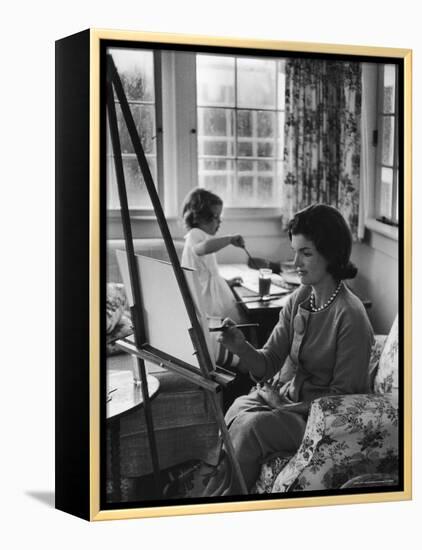 Jackie Kennedy, Wife of Sen, Painting on an easel as Daughter Caroline Paints on Table at Home-Alfred Eisenstaedt-Framed Premier Image Canvas