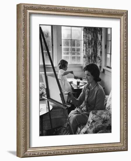 Jackie Kennedy, Wife of Sen, Painting on an easel as Daughter Caroline Paints on Table at Home-Alfred Eisenstaedt-Framed Photographic Print