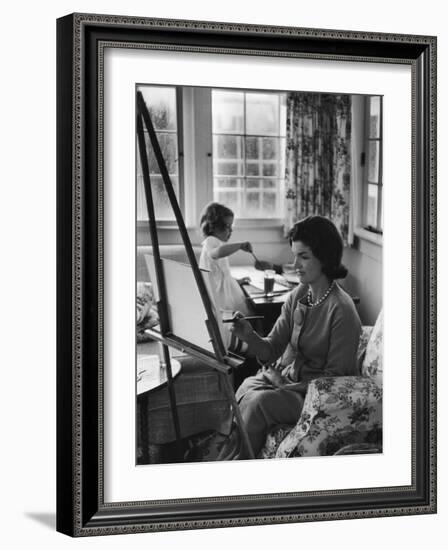 Jackie Kennedy, Wife of Sen, Painting on an easel as Daughter Caroline Paints on Table at Home-Alfred Eisenstaedt-Framed Photographic Print