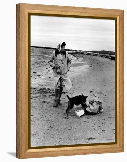 Jackie Kennedy, Wife of Sen, Walking Along Beach with Her Slicker Clad Daughter Caroline-Alfred Eisenstaedt-Framed Premier Image Canvas