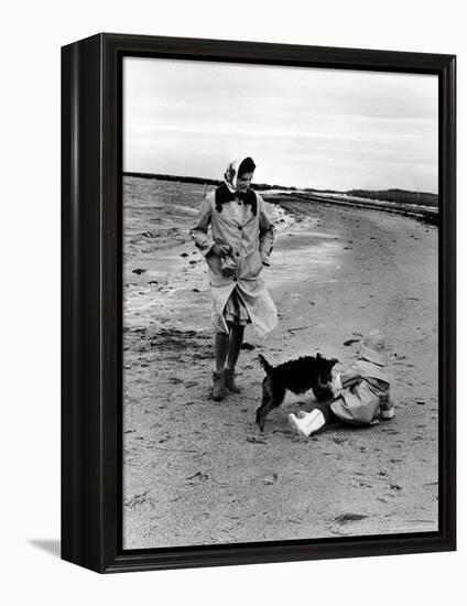 Jackie Kennedy, Wife of Sen, Walking Along Beach with Her Slicker Clad Daughter Caroline-Alfred Eisenstaedt-Framed Premier Image Canvas