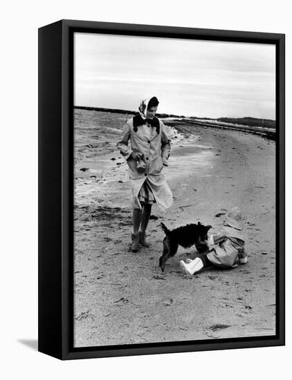 Jackie Kennedy, Wife of Sen, Walking Along Beach with Her Slicker Clad Daughter Caroline-Alfred Eisenstaedt-Framed Premier Image Canvas