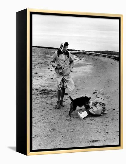 Jackie Kennedy, Wife of Sen, Walking Along Beach with Her Slicker Clad Daughter Caroline-Alfred Eisenstaedt-Framed Premier Image Canvas