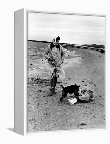 Jackie Kennedy, Wife of Sen, Walking Along Beach with Her Slicker Clad Daughter Caroline-Alfred Eisenstaedt-Framed Premier Image Canvas