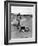 Jackie Kennedy, Wife of Sen, Walking Along Beach with Her Slicker Clad Daughter Caroline-Alfred Eisenstaedt-Framed Photographic Print