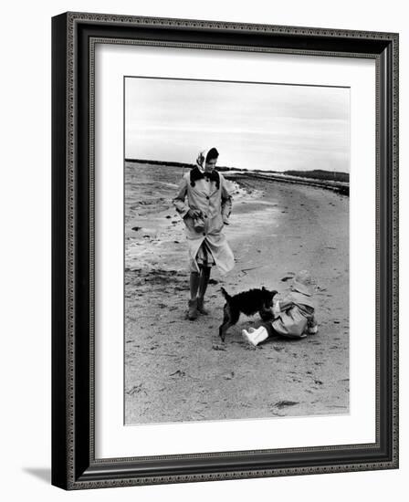 Jackie Kennedy, Wife of Sen, Walking Along Beach with Her Slicker Clad Daughter Caroline-Alfred Eisenstaedt-Framed Photographic Print