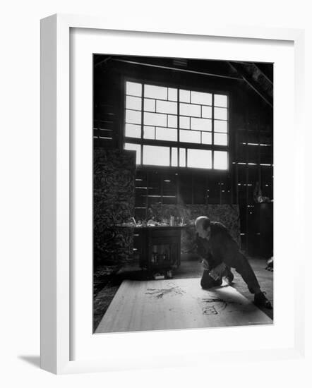 Jackson Pollock Working on a Painting-Martha Holmes-Framed Photographic Print