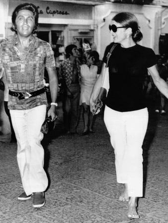 Jackie Kennedy Onassis (Nina Ricci Sunglasses, Gucci Bag) Leaving Crillon  Hotel, Paris, 1970