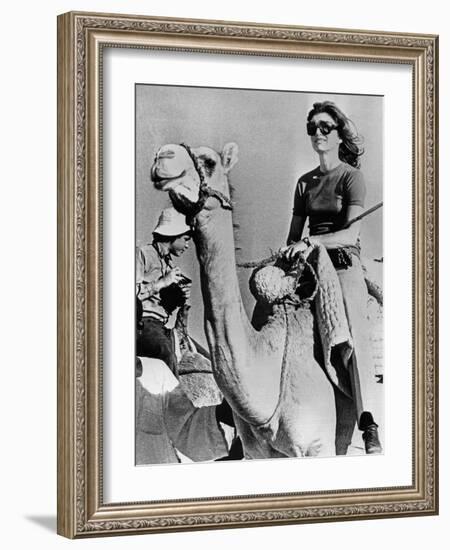 Jacqueline Kennedy Onassis Riding a Camel While on Vacation in Egypt, March 28, 1974-null-Framed Photo