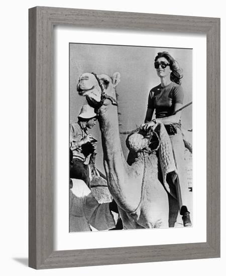 Jacqueline Kennedy Onassis Riding a Camel While on Vacation in Egypt, March 28, 1974-null-Framed Photo