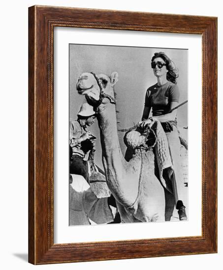 Jacqueline Kennedy Onassis Riding a Camel While on Vacation in Egypt, March 28, 1974-null-Framed Photo