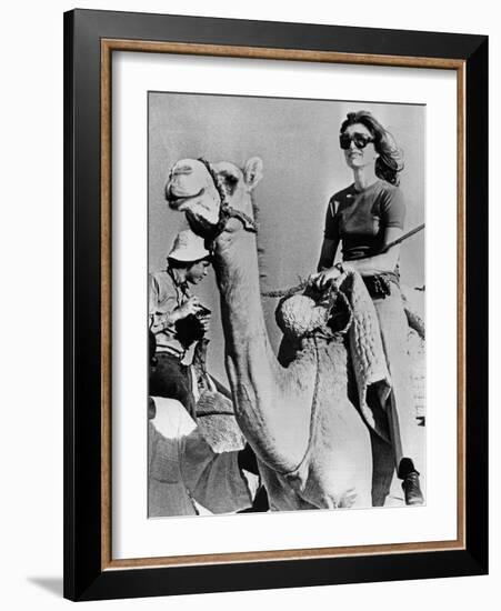 Jacqueline Kennedy Onassis Riding a Camel While on Vacation in Egypt, March 28, 1974-null-Framed Photo