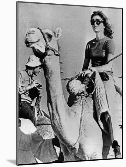 Jacqueline Kennedy Onassis Riding a Camel While on Vacation in Egypt, March 28, 1974-null-Mounted Photo