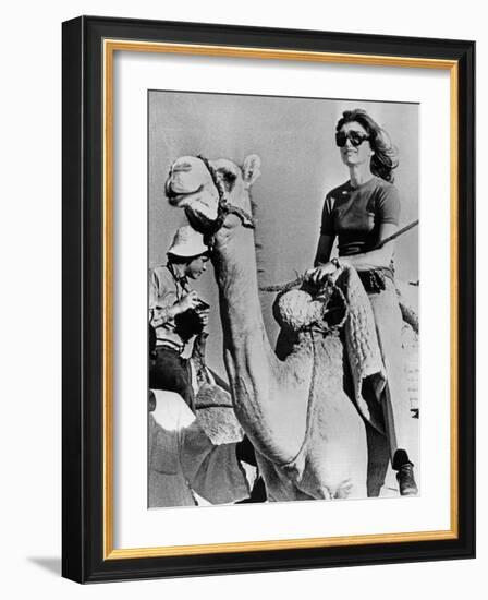 Jacqueline Kennedy Onassis Riding a Camel While on Vacation in Egypt, March 28, 1974-null-Framed Photo