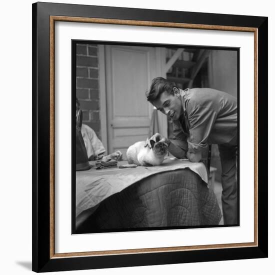 Jacques Brel Cuddling His Cat, September 1959-Marcel Begoin-Framed Photographic Print