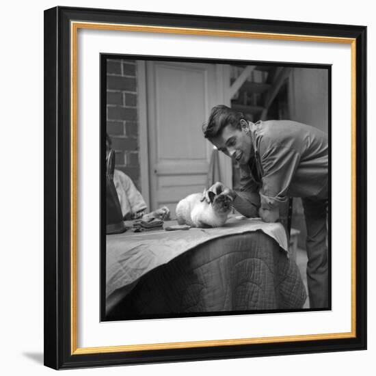 Jacques Brel Cuddling His Cat, September 1959-Marcel Begoin-Framed Photographic Print