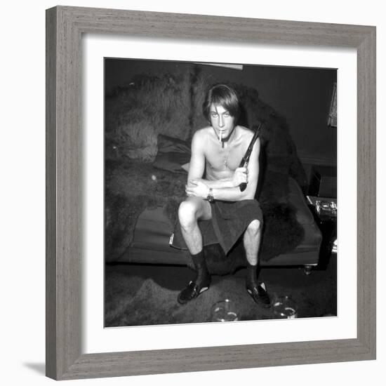 Jacques Dutronc Smoking a Cigarette and Holding a Revolver in 1971-Roldes-Framed Photographic Print