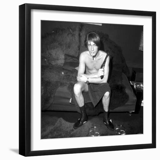 Jacques Dutronc Smoking a Cigarette and Holding a Revolver in 1971-Roldes-Framed Photographic Print