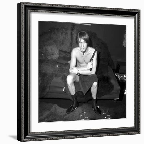 Jacques Dutronc Smoking a Cigarette and Holding a Revolver in 1971-Roldes-Framed Photographic Print