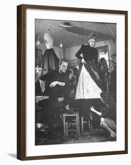 Jacques Fath Watching as the Tailor Hymns the Loose Ends at the Bottom of the Dress-Nina Leen-Framed Premium Photographic Print
