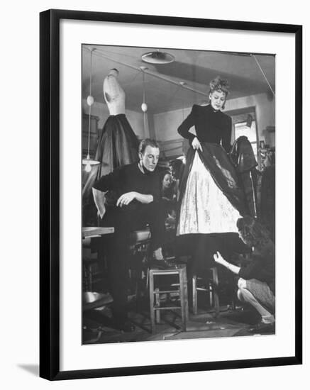 Jacques Fath Watching as the Tailor Hymns the Loose Ends at the Bottom of the Dress-Nina Leen-Framed Premium Photographic Print