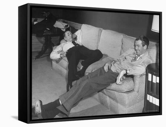 James Stewart Stretched Out on Office Sofa, Smiling, Producer Leland Hayward Slouches at Other End-John Florea-Framed Premier Image Canvas