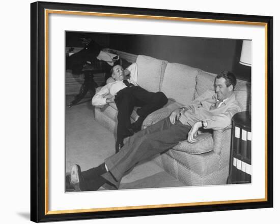 James Stewart Stretched Out on Office Sofa, Smiling, Producer Leland Hayward Slouches at Other End-John Florea-Framed Premium Photographic Print