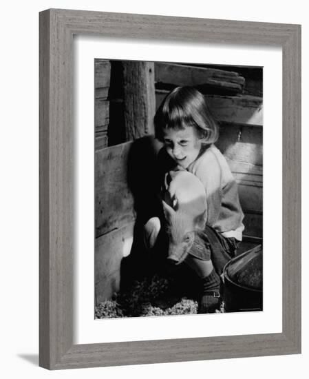 Jan Bruene with Piglet of a Group 2-3 Weeks Old, Kept in Basement of Home-Gordon Parks-Framed Photographic Print
