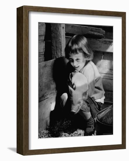 Jan Bruene with Piglet of a Group 2-3 Weeks Old, Kept in Basement of Home-Gordon Parks-Framed Photographic Print