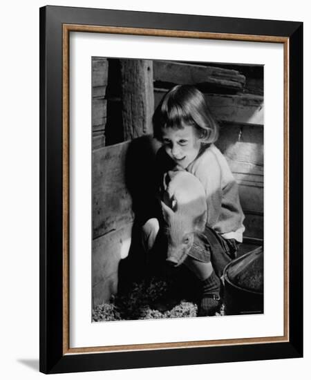 Jan Bruene with Piglet of a Group 2-3 Weeks Old, Kept in Basement of Home-Gordon Parks-Framed Photographic Print