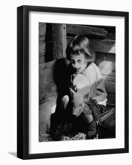 Jan Bruene with Piglet of a Group 2-3 Weeks Old, Kept in Basement of Home-Gordon Parks-Framed Photographic Print