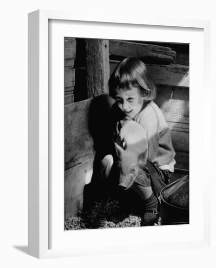 Jan Bruene with Piglet of a Group 2-3 Weeks Old, Kept in Basement of Home-Gordon Parks-Framed Photographic Print