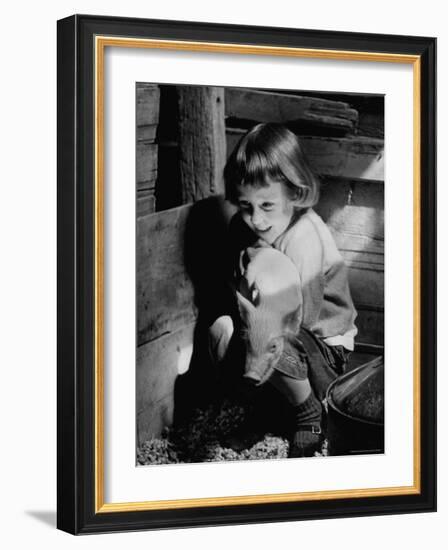 Jan Bruene with Piglet of a Group 2-3 Weeks Old, Kept in Basement of Home-Gordon Parks-Framed Photographic Print