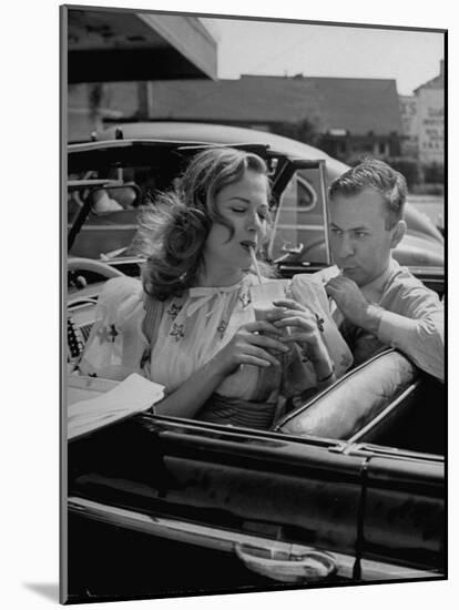 Jane Nigh and Fine Stopping at a Drive in For Cold Drinks-Walter Sanders-Mounted Photographic Print