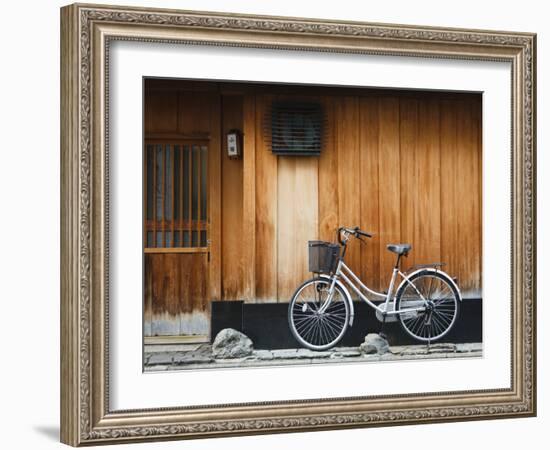 Japan, Chubu Region, Kyoto, Gion, a Bicycle Rests Against the Wall of a Traditional Building-Nick Ledger-Framed Photographic Print