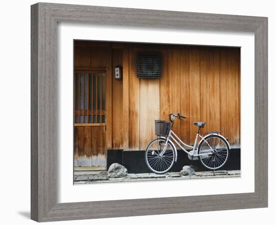 Japan, Chubu Region, Kyoto, Gion, a Bicycle Rests Against the Wall of a Traditional Building-Nick Ledger-Framed Photographic Print