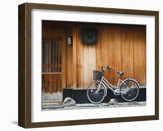 Japan, Chubu Region, Kyoto, Gion, a Bicycle Rests Against the Wall of a Traditional Building-Nick Ledger-Framed Photographic Print