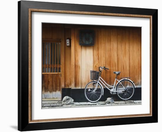 Japan, Chubu Region, Kyoto, Gion, a Bicycle Rests Against the Wall of a Traditional Building-Nick Ledger-Framed Photographic Print