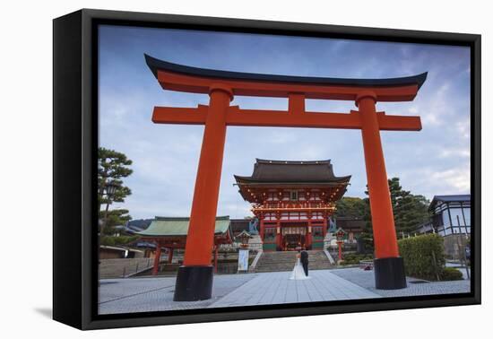 Japan, Kyoto, a Wedding Bride and Groom Pose at Fushimi Inari Shrine-Jane Sweeney-Framed Premier Image Canvas