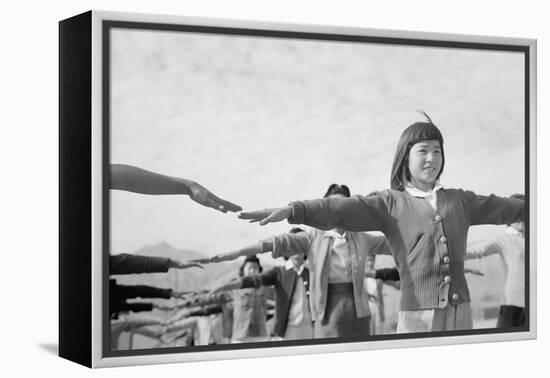Japanese-American girls exercising at Manzanar, 1943-Ansel Adams-Framed Premier Image Canvas
