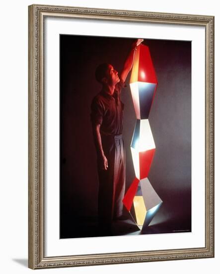 Japanese American Sculptor Isamu Noguchi Adjusting a Light Sculpture He Designed-Eliot Elisofon-Framed Premium Photographic Print